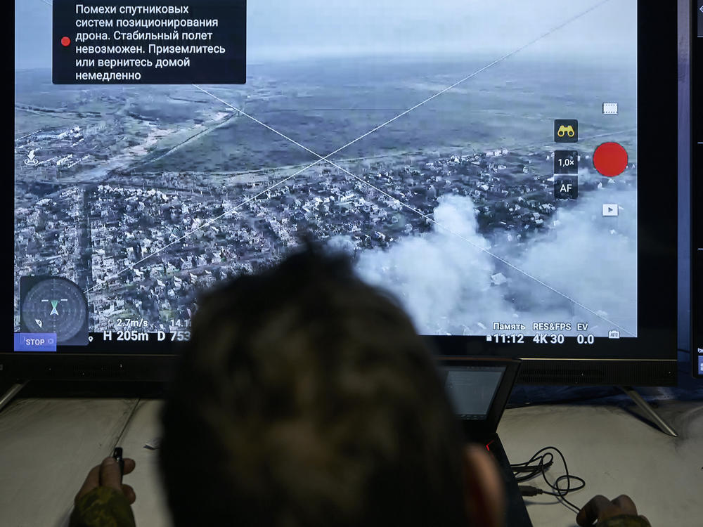 A Ukrainian soldier watches a drone feed from an underground command center in Bakhmut, Donetsk region, Ukraine, Sunday, Dec. 25, 2022.