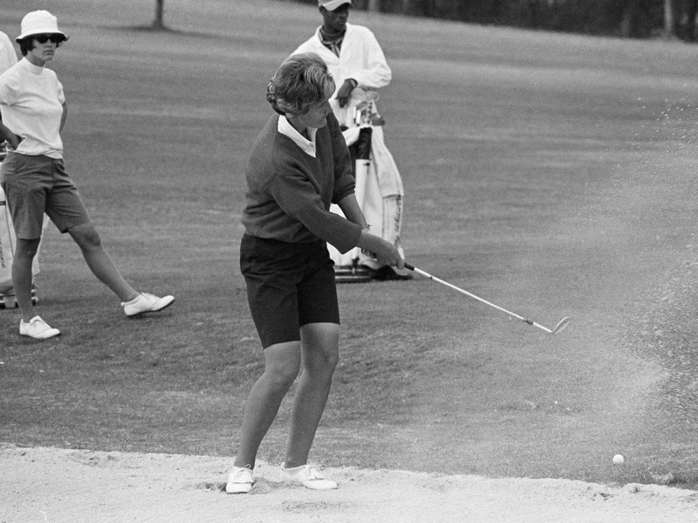 Kathy Whitworth blast out of a sand trap during the Women Titleholders Golf Tournament at Augusta, Ga., on Nov. 25, 1966. Whitworth, whose 88 victories are the most by any golfer, died on Saturday at age 83.