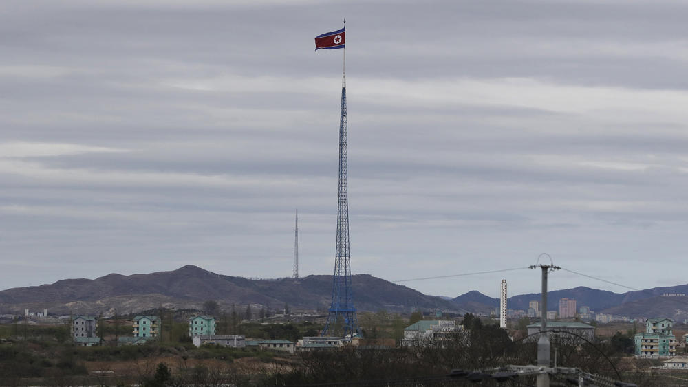 South Korea says it fired warning shots after North Korean drones violated its airspace. In this 2018 photo, a North Korean flag flutters atop a 160-meter tower in North Korea's village Gijungdongseen, as seen from the Taesungdong freedom village inside the demilitarized zone in Paju, South Korea.