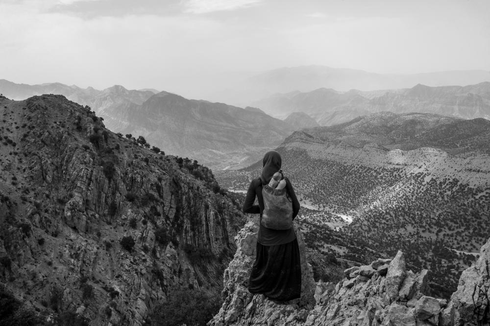 Fereshteh, 14, is photographed in the central Zagros mountains, where her tribe spends spring and summer. They travel many hours on rough paths throughout the year, from pasture to pasture — and then there's the yearly 10-hour journey from their summer home to their winter home. She says she does not like the nomadic way of life but feels she has no choice but to accept and endure it.