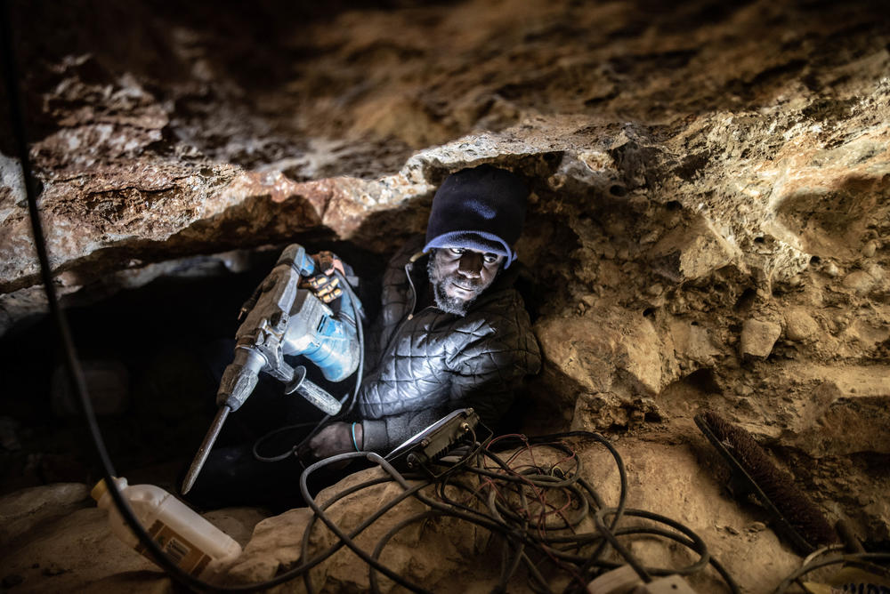 Jefferson Ncube, an illegal diamond miner from Zimbabwe, works on his latest tunnel at an abandoned De Beers mine near Kleinzee, South Africa. Ncube is a univeristy graduate, but has been unable to find employment.