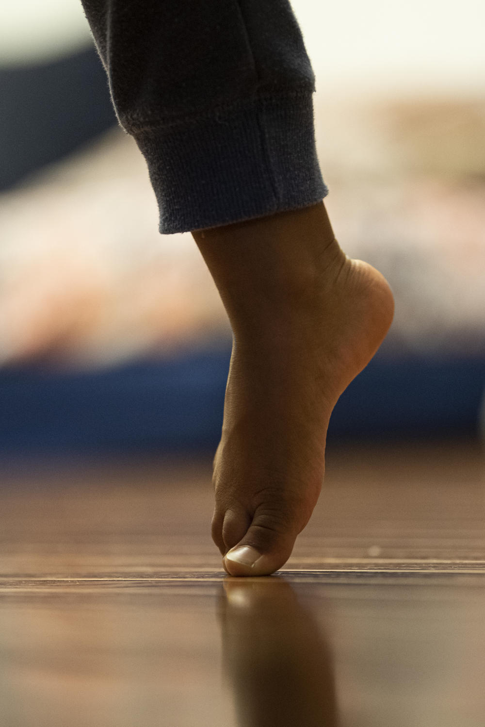 Ridhay Vemuri stands on his toes as he rests after playing. Second-generation immigrant kids are constantly grappling with their identities, as they struggle to feel accepted completely as either Americans or Indians.