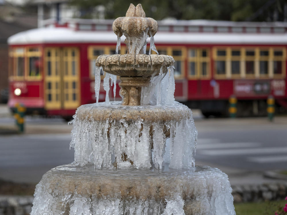 The fountain is frozen as temperatures hovered in the mid 20s at Jacob Schoen & Son Funeral Home in New Orleans on Dec. 24, 2022.