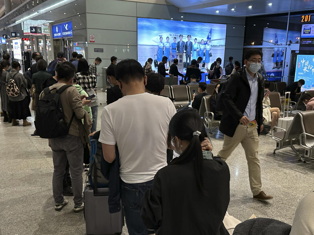 Passengers prepare to board a flight at the airport in north-central China's Jiangxi province on Nov. 1, 2022.