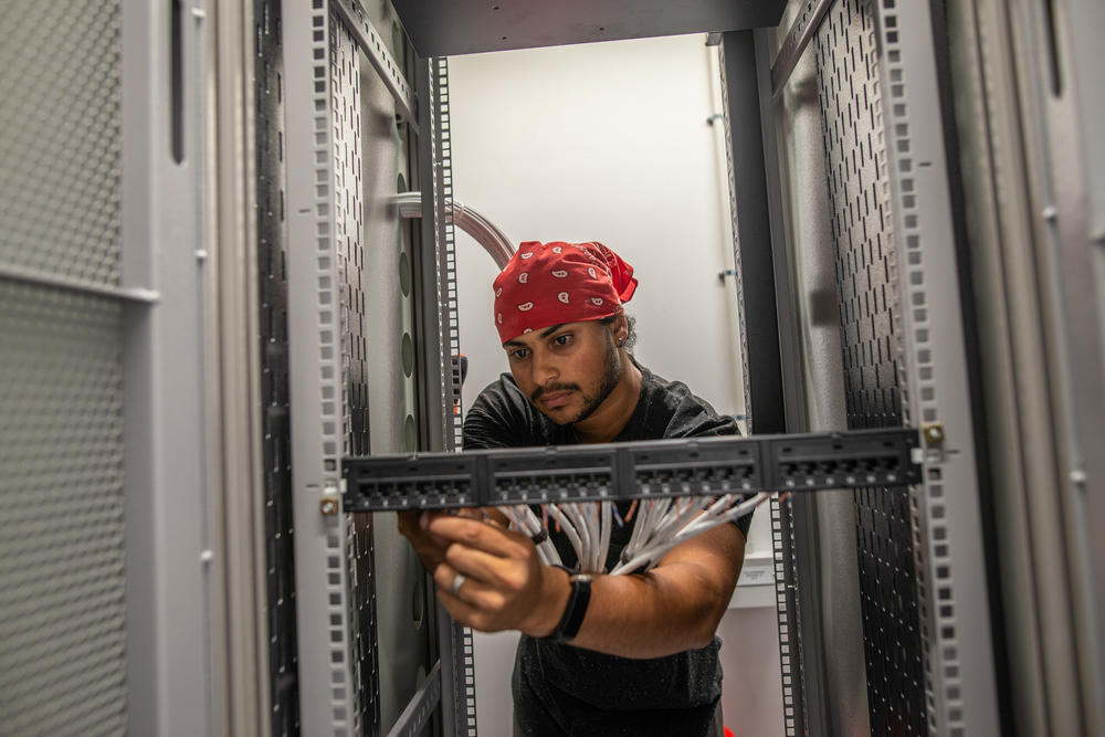 Technician Jaydee Wessie works to complete a new section of Afrigen's laboratory. The facility has been a hive of activity ever since Afrigen was selected for the mRNA vaccine project.