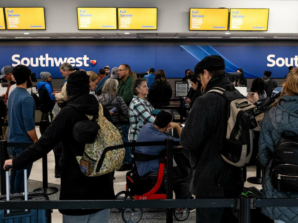 Travelers wait in line at the Southwest Airlines ticketing counter at Nashville International Airport on Tuesday.