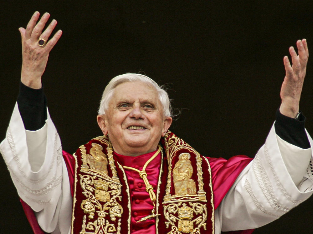 Pope Benedict XVI greets the crowd from the central balcony of St. Peter's Basilica at the Vatican in 2005, soon after his election.