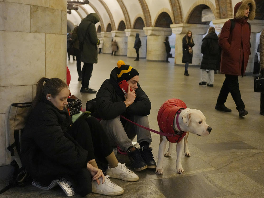 People rest in the subway station being used as a bomb shelter during a rocket attack in Kyiv, Ukraine, Thursday.