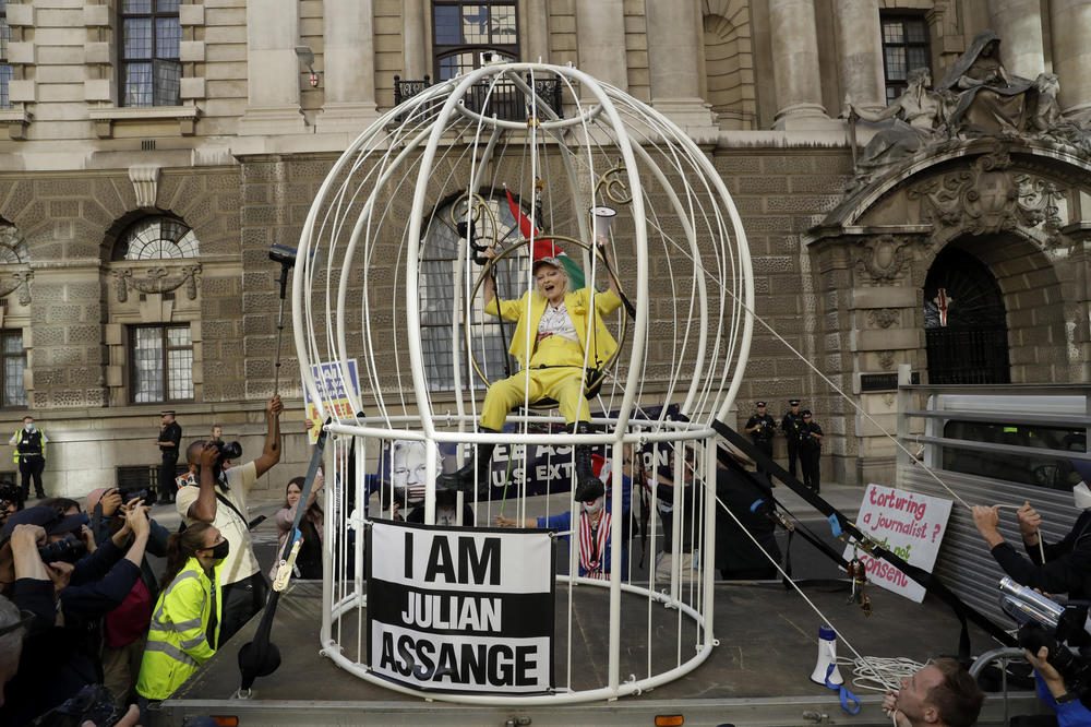 Fashion designer Vivienne Westwood sits suspended in a giant bird cage in protest against the extradition of WikiLeaks founder Julian Assange to the U.S., outside the Old Bailey court, in London on July 21, 2020.
