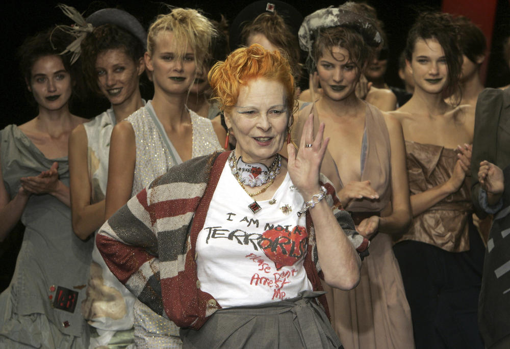 Models applaud as British fashion designer Vivienne Westwood salutes the public after the presentation of her Spring/Summer 2006 collection in Paris, Tuesday, Oct. 4, 2005.