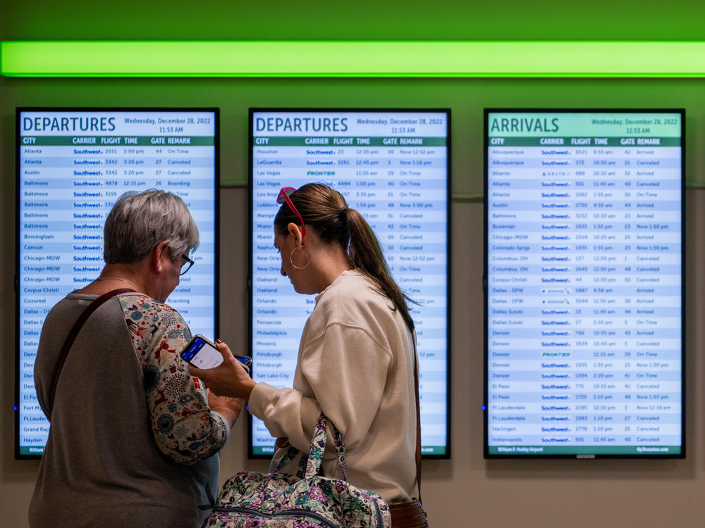 Travelers search through flights after arriving at the William P. Hobby Airport on December 28, 2022 in Houston, Texas.