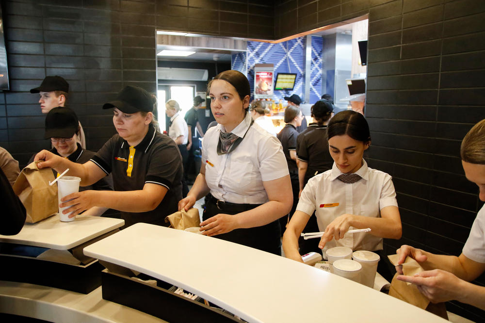 Restaurant staff serves customers at a branch of a new Russian fast-food chain, Vkusno i Tochka, in St. Petersburg, Russia, on June 22. Branches of the restaurant opened in McDonald's locations across Russia.