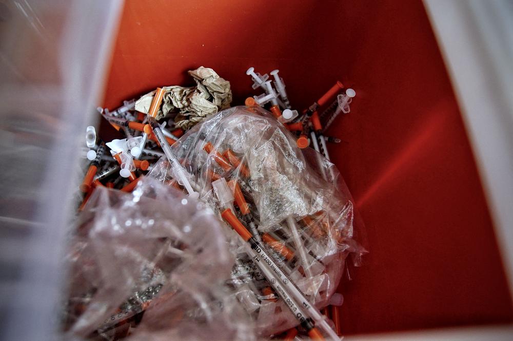Used syringes, collected by the staff of the Family and Medical Counseling Service Inc. (FMCS), are seen in a container inside the FMCS van in Washington, D.C., on April 21. Several organizations in the U.S. capital are trying to fight the harm caused by fentanyl, an ultra-powerful and addictive synthetic opioid. In 2021, 95 percent of the city's fatal opioid overdoses were fentanyl-related.