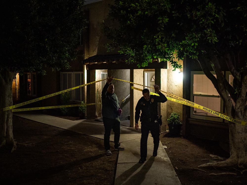 Ed Byrne, Homeland Security investigations agent, left, and Lt. Ken Impellizeri of the San Diego Police leave the scene of a fatal fentanyl overdose by a 39-year-old woman in San Diego, Calif., on Nov. 10.