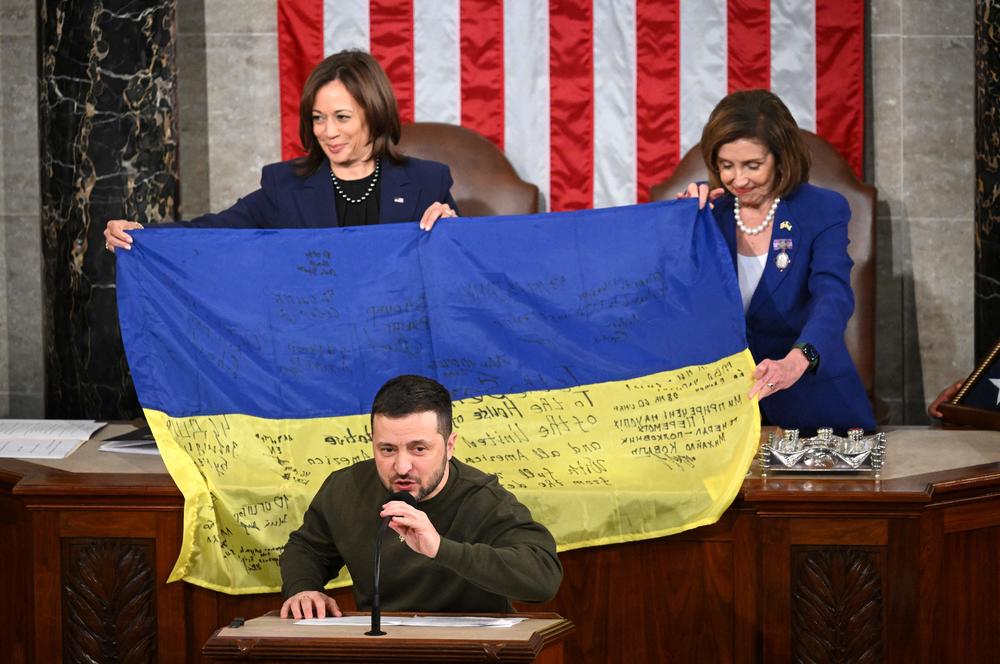 Ukrainian President Volodymyr Zelenskyy speaks after giving a Ukrainian national flag to House Speaker Nancy Pelosi, D-Calif., and Vice President Harris during his address to Congress on Dec. 21.