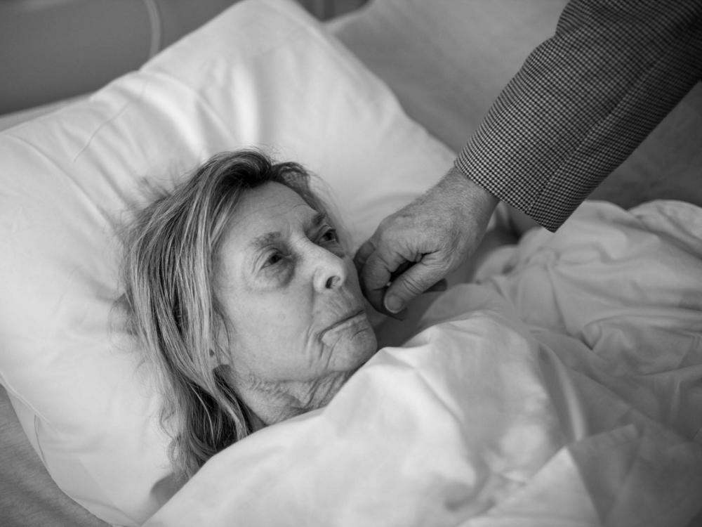 Audrey Grinker receives a visit from her doctor after friends found her on the floor of her apartment, she had mixed up her medications and became very ill. She was acting out in the hospital, trying to escape, sitting on the floor near the nurses' station, and walking into other patient's rooms. Aventura Hospital, Miami, Fla., March, 2017.