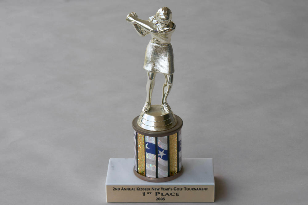 A 1st Place golf trophy from 2005. Audrey was an avid golfer. Her trophies were kept on her shelves. Some of the people who worked at the assisted living facility loved talking to her about golf, as did her doctors.