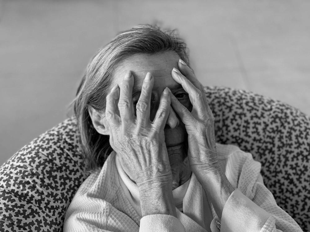 Audrey jokes around after agreeing to let Lori photograph her as she begins a series of medical tests following her quarterly blood test. Aventura, Miami, Fla., March 28, 2020.