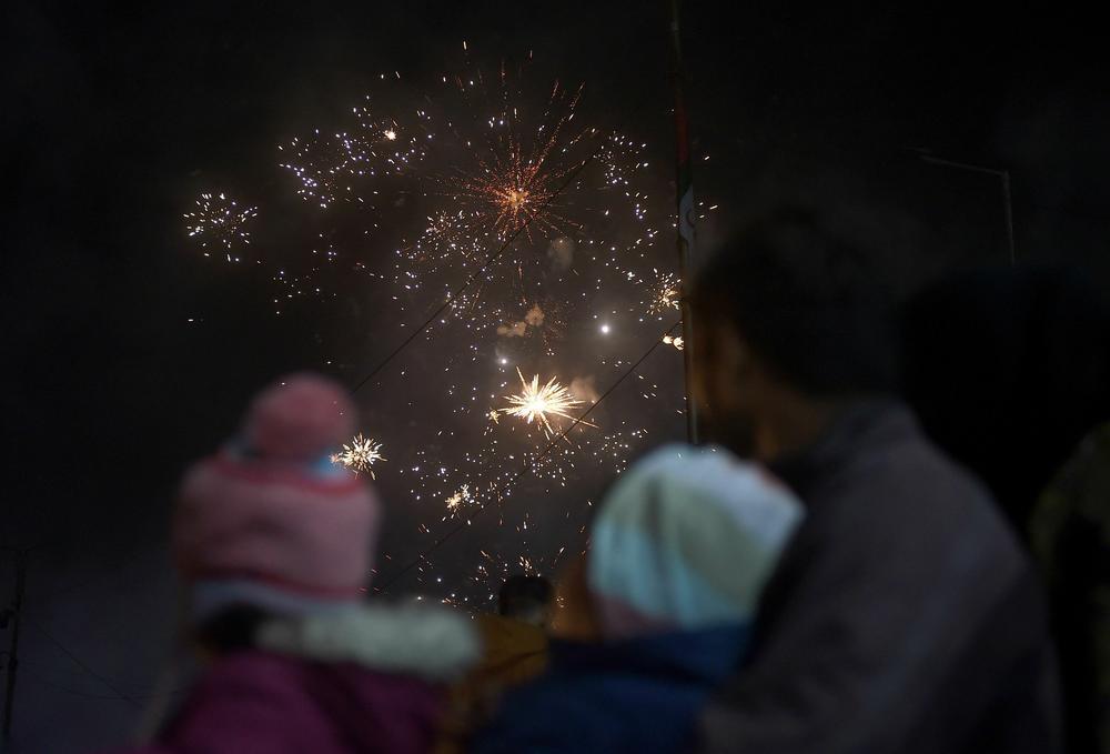 People watch a fireworks show in Karachi.