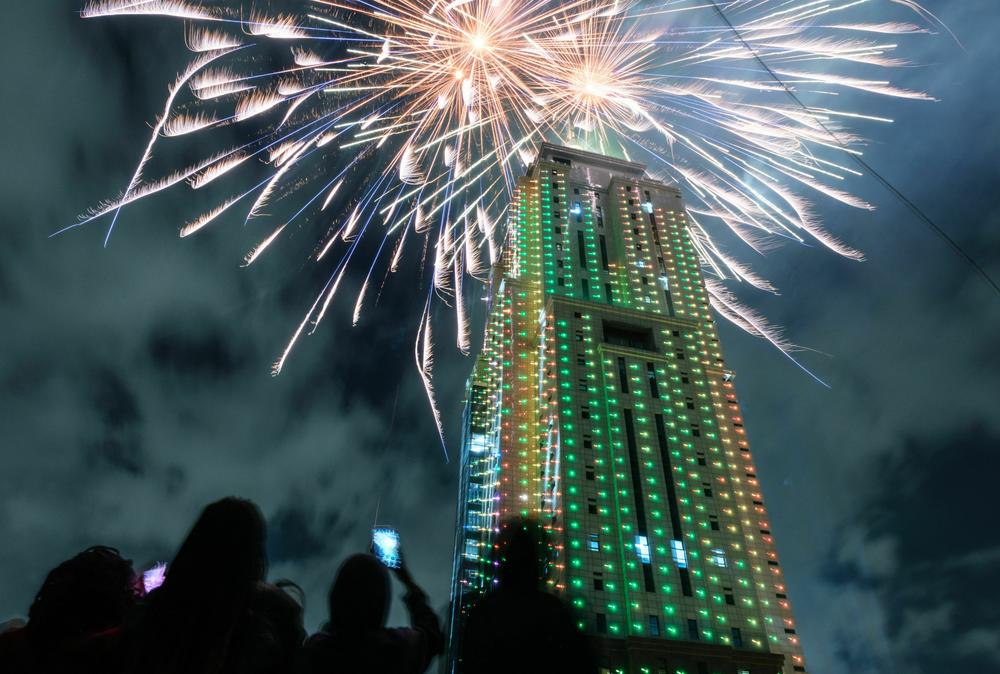 People look at fireworks launching from the building of Old Mutual Tower to celebrate the new year in Nairobi.