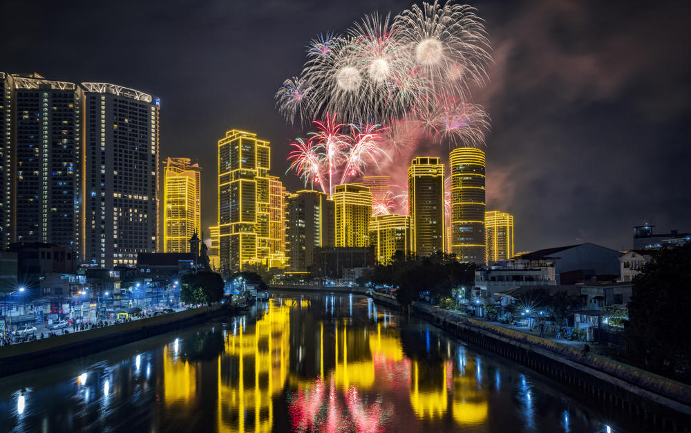 Fireworks explode over buildings during New Year's celebrations in Manila, Philippines.