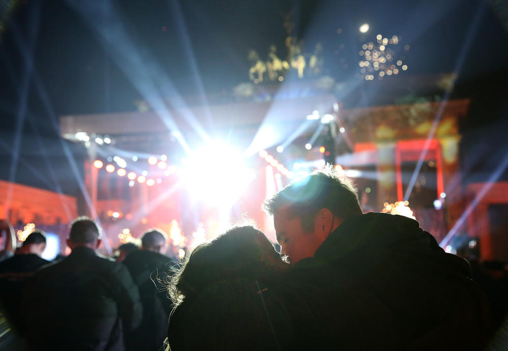 Visitors celebrate the new year at the Brandenburg Gate in Berlin, Germany.