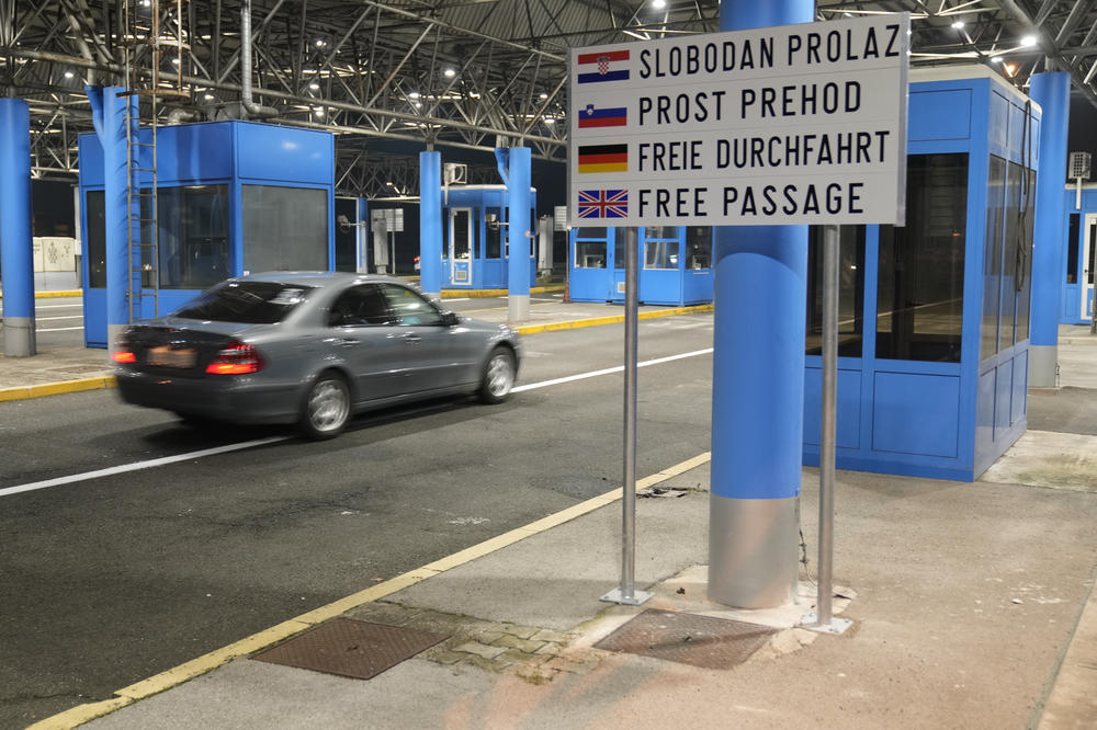 A motorist drives without interruption at the Bregana border crossing between Croatia and Slovenia, early on Sunday.