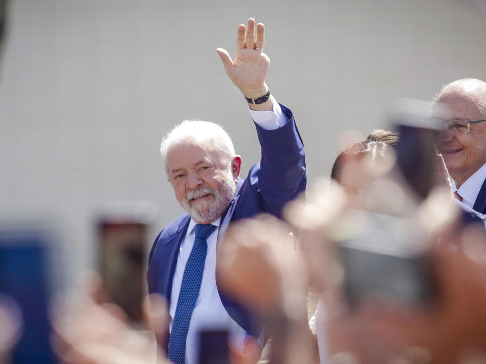 President-elect Luiz Inácio Lula da Silva waves from an open car after departing from the Metropolitan Cathedral to Congress for his swearing-in ceremony, in Brasília, Brazil, on Sunday.