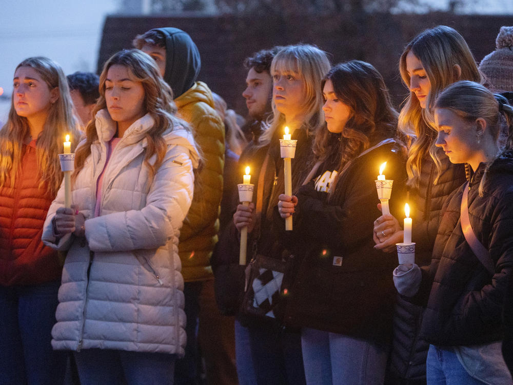 Boise State University students, along with people who knew the four University of Idaho students who were found killed in Moscow, Idaho, in November, pay their respects at a vigil on November 17.