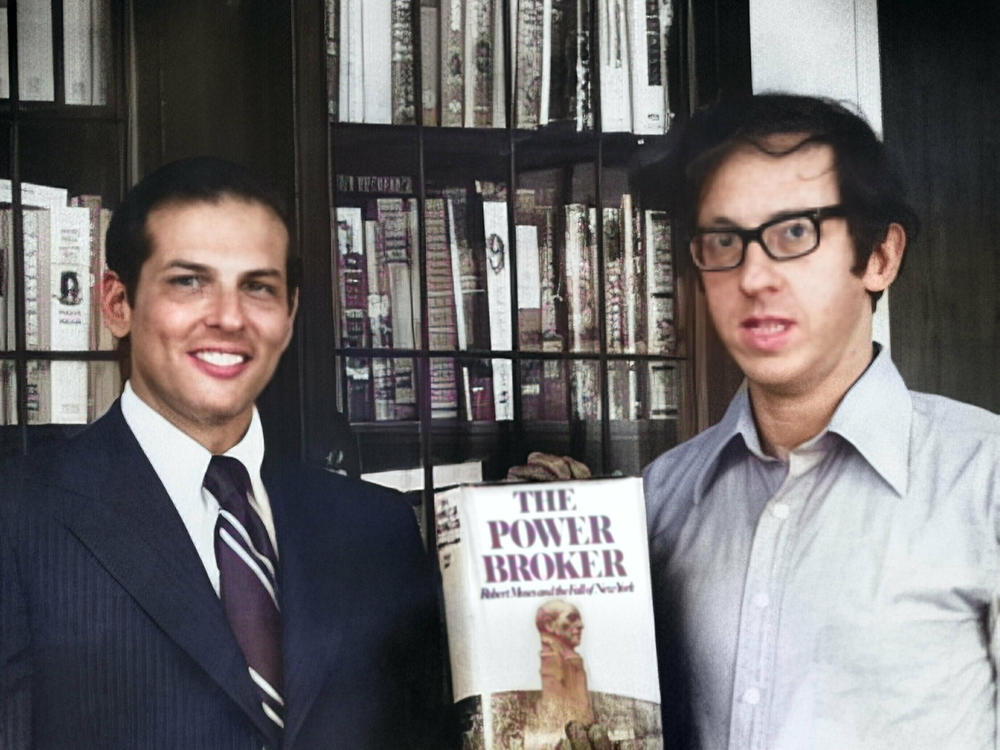 Robert Caro and Robert Gottlieb pose in 1974 with Caro's book, <em>The Power Broker.</em>