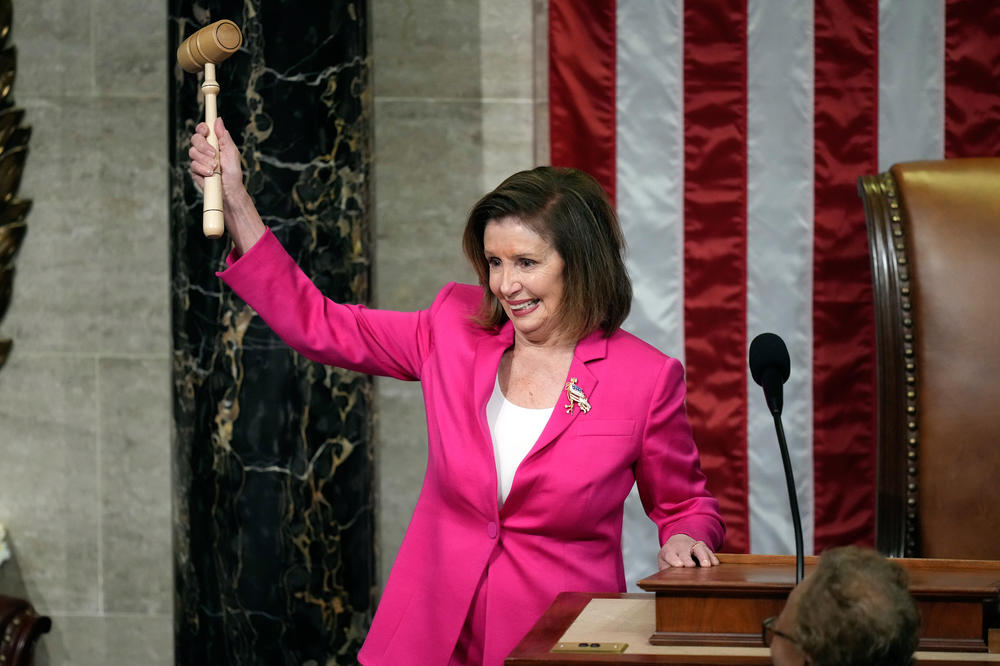 Outgoing House Speaker Nancy Pelosi of California holds the gavel as she calls the first session of the 118th Congress to order on Tuesday.