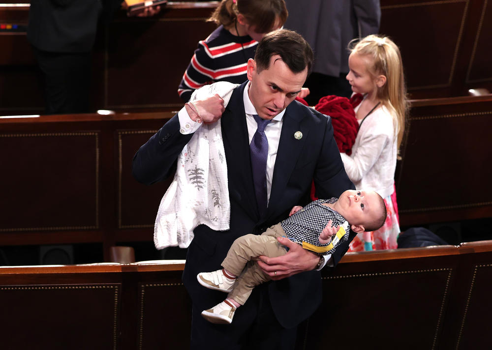 Incoming Rep. Robert Menendez Jr., a Democrat from New Jersey, holds his child during the first day of the 118th Congress in the U.S. Capitol's House chamber on Jan. 3.