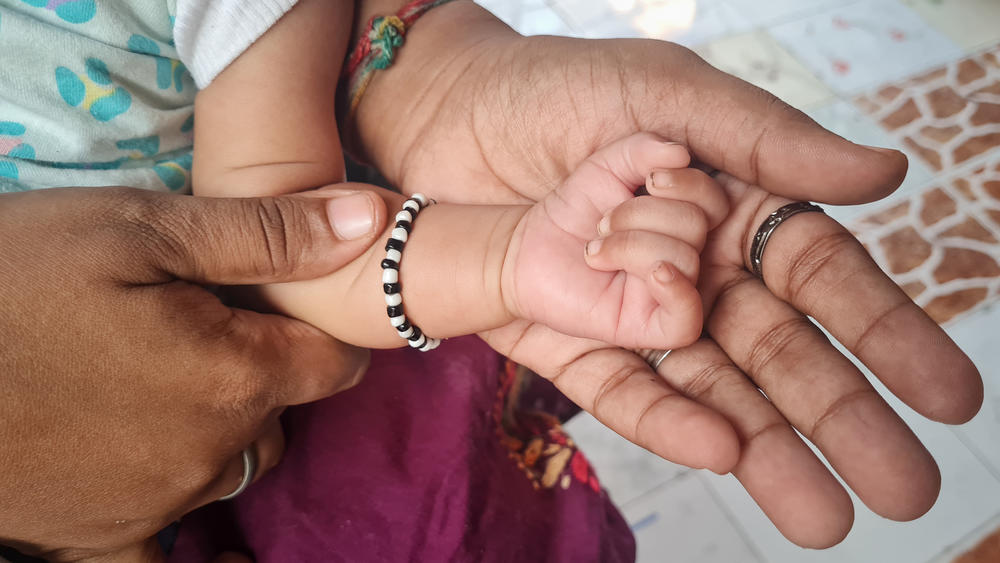 The little hand of Vehant Singh, at 1 month, rests on the hand of his mother, 24-year-old Naina Agrahari. His name is a Hindi word meaning intelligent. The photo was taken at their family home on the northern outskirts of Mumbai.