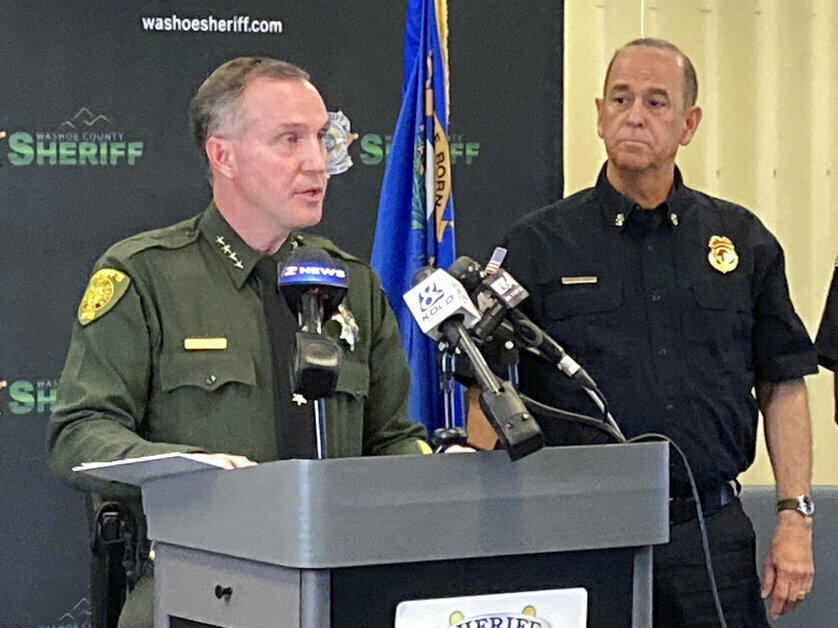 Washoe County Sheriff Darin Balaam, left, answers a reporter's question as fire officials look on Tuesday during a news conference in Reno, Nev., about the accident that seriously injured actor Jeremy Renner on a private mountain road near Lake Tahoe on New Year's Day.