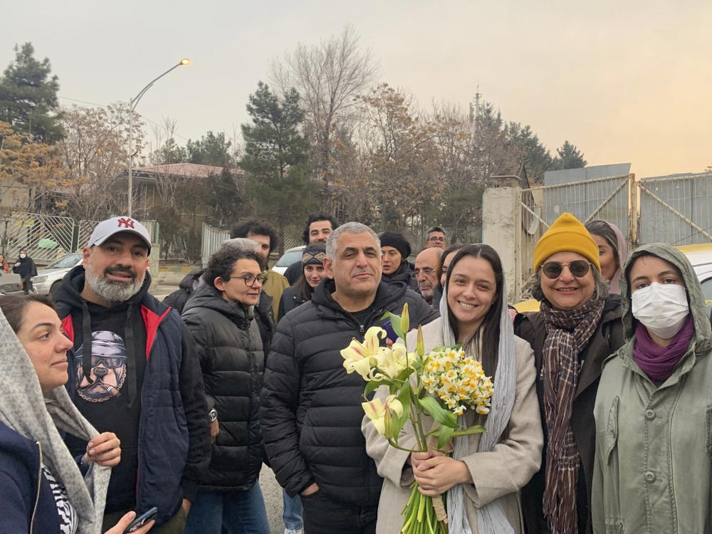 Prominent Iranian actress Taraneh Alidoosti (center) holds flowers as she poses for a photo among her friends after being released from Evin prison in Tehran, Iran, on Wednesday.