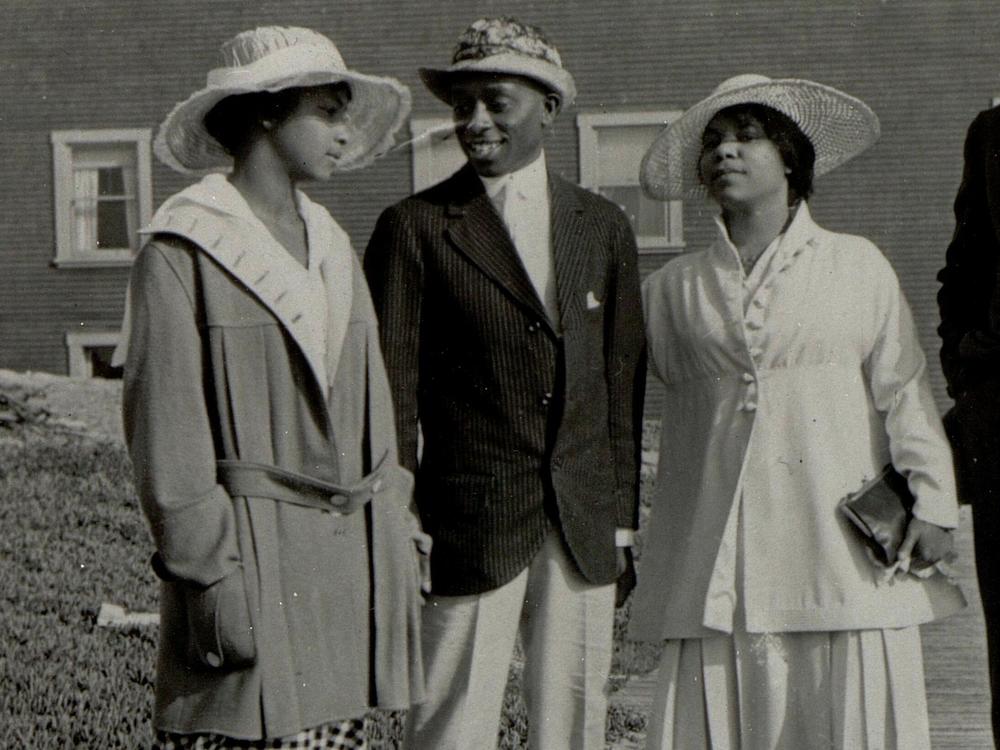 Two couples stand on a walkway at the Bruce's Beach resort in Manhattan Beach, Calif., circa 1920. A few years later, the city condemned the property and seized it from its Black owners.