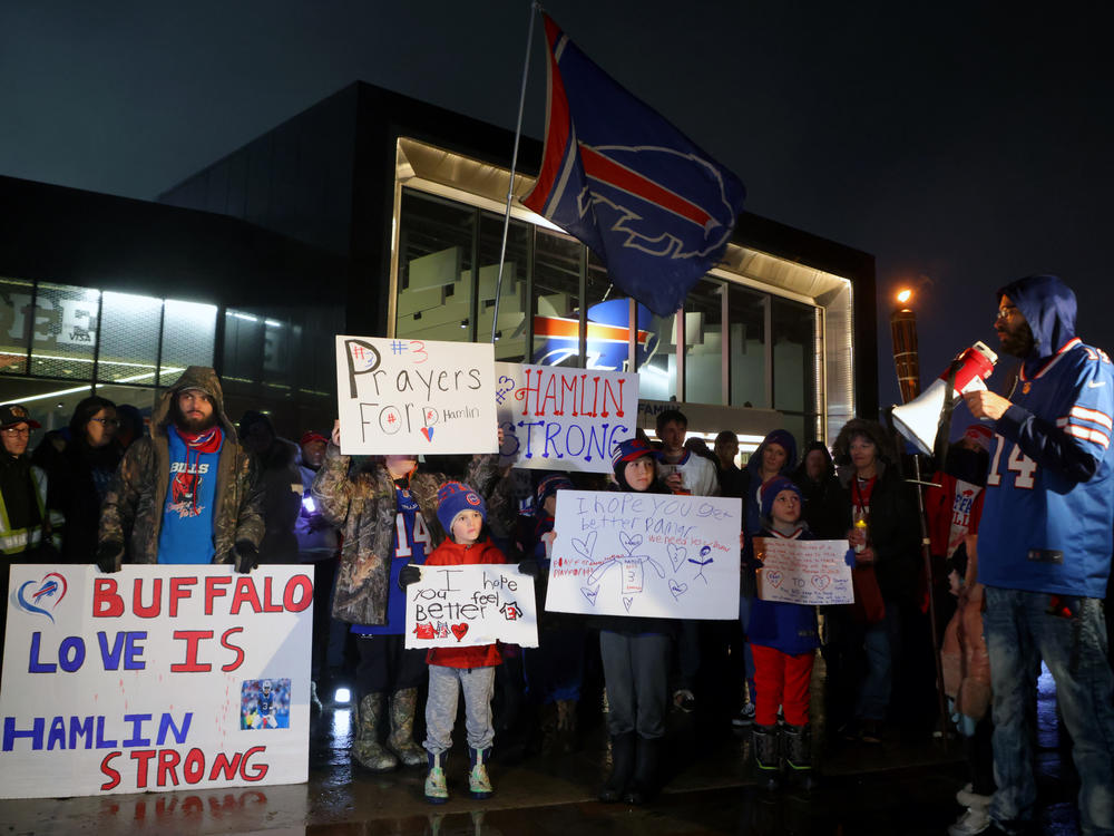 Buffalo Bills fans attend a candlelight prayer vigil for player Damar Hamlin at Highmark Stadium on Tuesday in Orchard Park, N.Y.