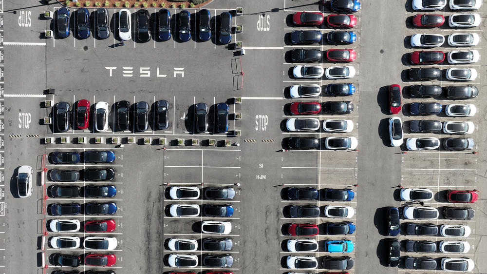 Brand-new Tesla cars sit in a parking lot at the Tesla factory in Fremont, Calif., in October. Tesla stock lost 65% of its value in 2022.