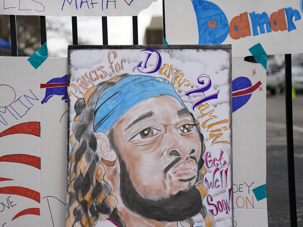 An artist's portrait of Buffalo Bills safety Damar Hamlin is displayed Thursday outside UC Medical Center, where the 24-year-old remains hospitalized.