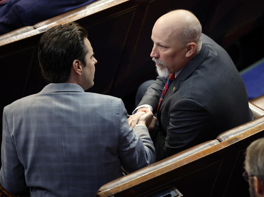 Rep.-elect Matt Gaetz, R-Fla., greets Rep.-elect Chip Roy, R-Texas, in the House Chamber during the fourth day of elections for Speaker of the House. Both Republicans at one point this week voted against McCarthy.