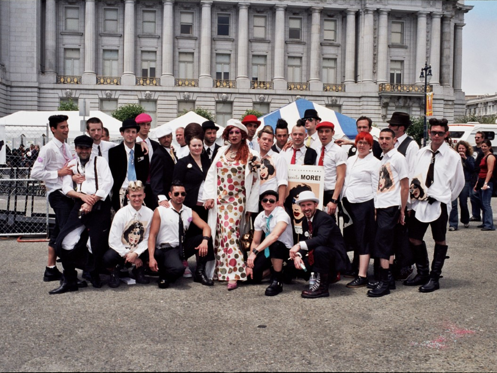 San Francisco drag queen Juanita MORE! poses at the center of her chosen family. For many queer people, creating one can be a necessary key to surviving.