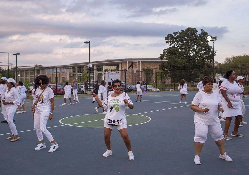 At a line dancing social event held in Washington D.C., dancers showed off their moves set to hip-hop and R&B music.