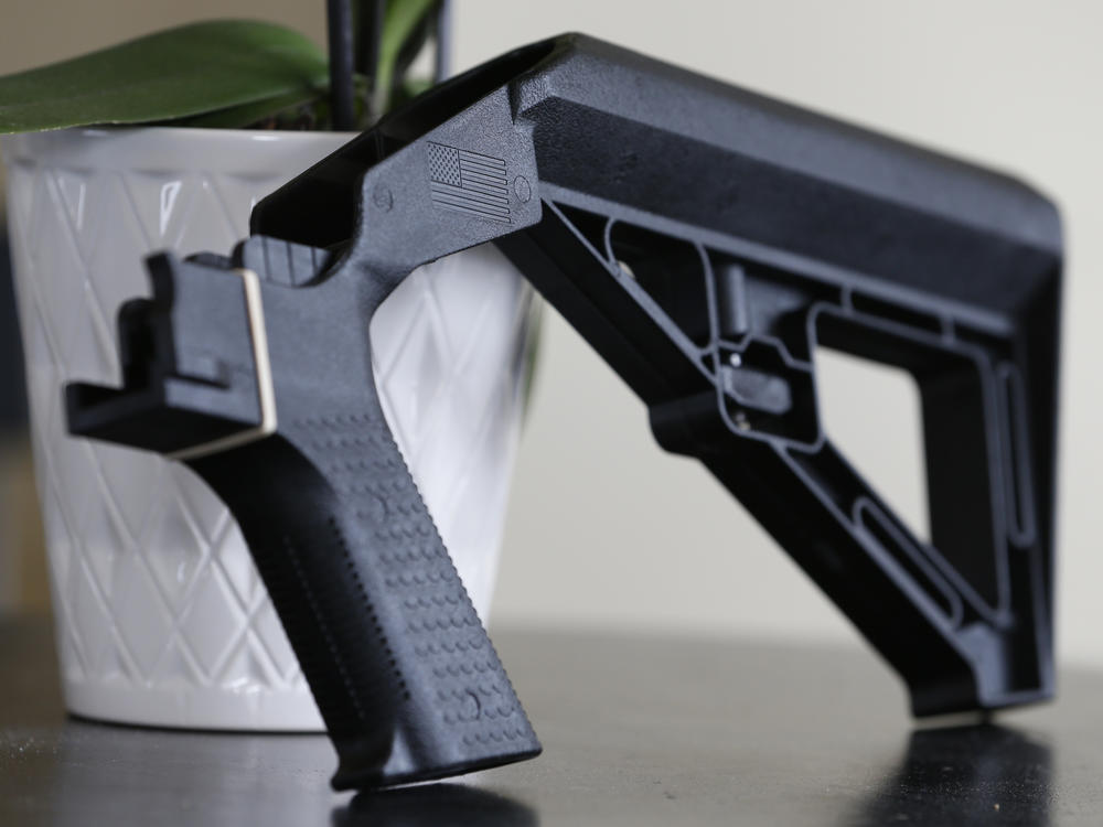 A bump stock is displayed on March 15, 2019, in Harrisonburg, Va. A Trump administration ban on bump stocks, devices that enable a shooter to rapidly fire multiple rounds from semi-automatic weapons after an initial trigger pull, was struck down Friday by a federal appeals court in New Orleans.