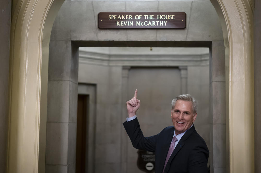 House Speaker Kevin McCarthy of California gestures toward the newly installed nameplate at his office after he was sworn in as speaker of the 118th Congress.