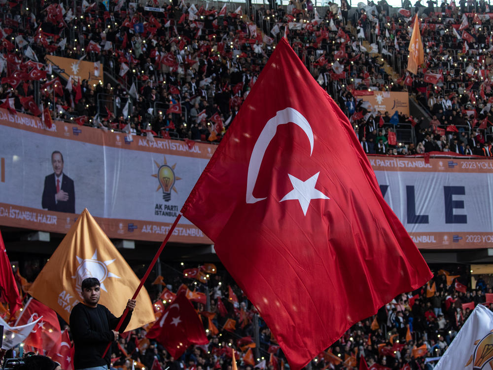 Supporters wave flags and cheer as they listen to Turkey's President Recep Tayyip Erdogan speak during the ruling AKP party's rally on Nov. 27, 2022 in Istanbul, Turkey.