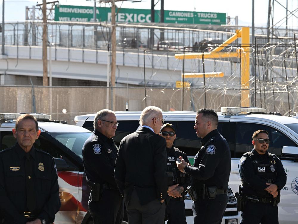 President Biden speaks with U.S. Customs and Border Protection police at the Bridge of the Americas border crossing between Mexico and the U.S. in El Paso, Texas, on Sunday.