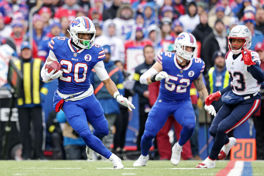 Nyheim Hines of the Buffalo Bills returns the opening kickoff for a touchdown during Sunday's game against the New England Patriots.