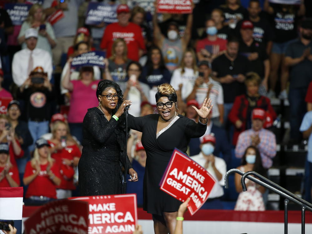 Lynnette Hardaway, left, and Rochelle Richardson, known as Diamond and Silk, speak at a Trump campaign rally in Tulsa, Okla., in June 2020.