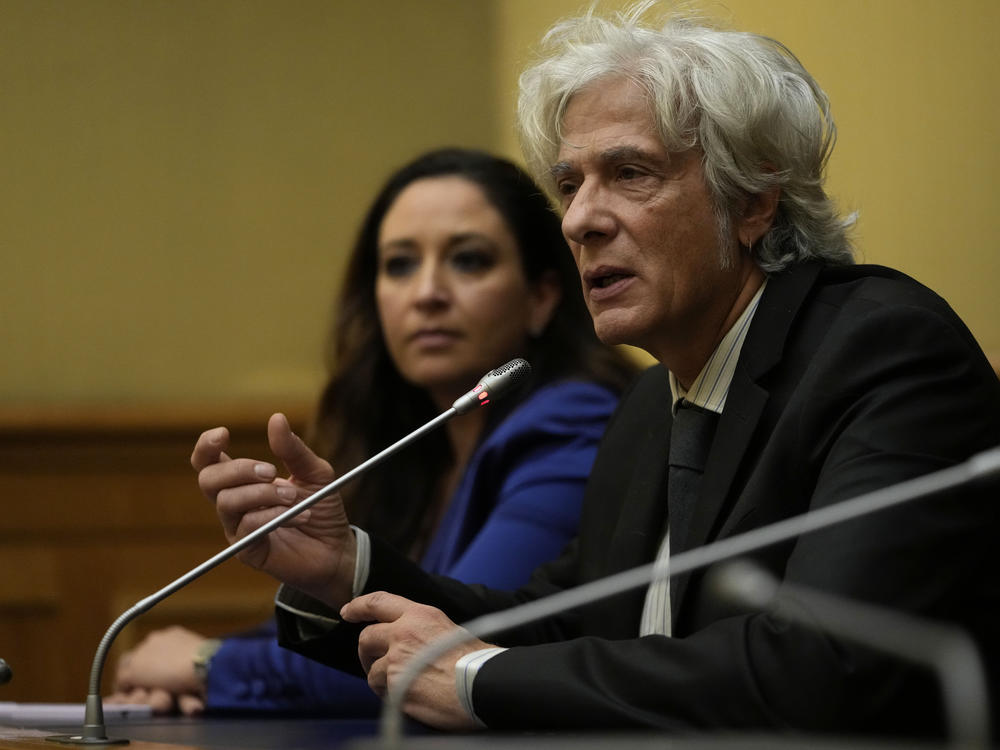 Pietro Orlandi, right, brother of Manuela, a 15-year-old daughter of a Vatican employee disappeared in 1983, is flanked by his lawyer Laura Sgro as he attends a press conference on the establishing of a parliamentary investigative commission on Manuela Orlandi and other cold cases in Rome, Tuesday, Dec. 20, 2022.