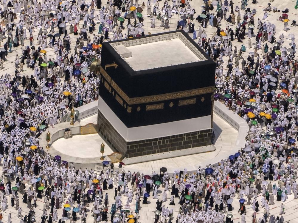 Muslim pilgrims walk around the Kaaba, the cubic building at the Grand Mosque, during the annual hajj pilgrimage, in Mecca, Saudi Arabia, on July 10, 2022.